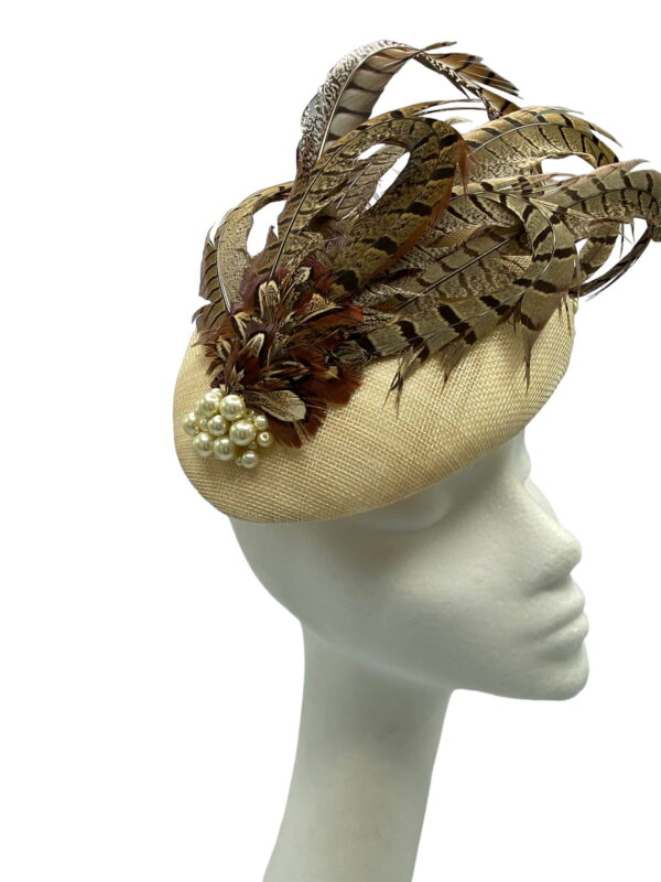 Stunning feather headpiece with pearl bead detail to finish.